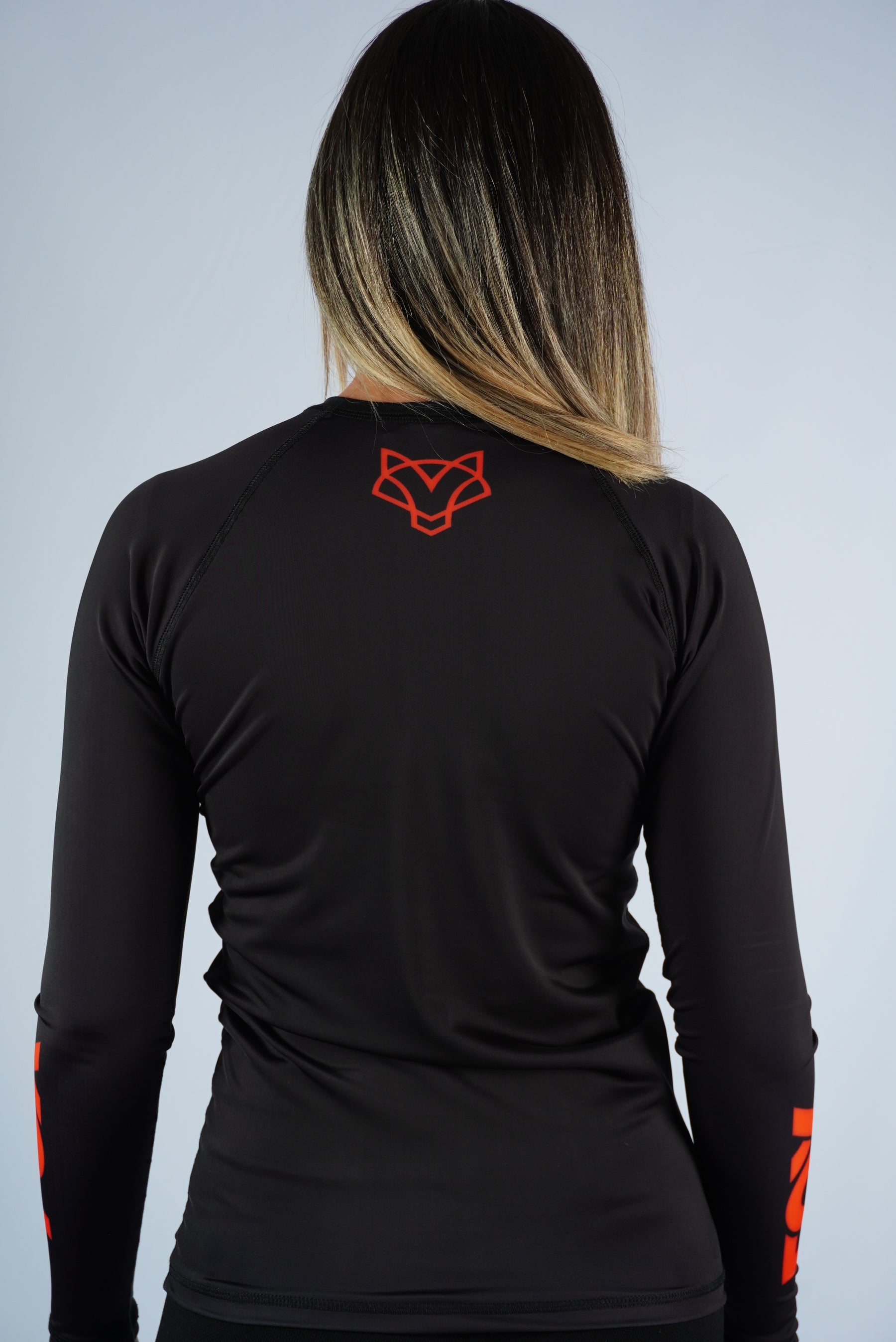 Rash Guard Jiu-Jitsu Feminina FOX FW Preta Manga Longa (Logo Laranja) UV 50+
