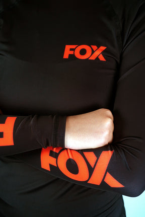 Rash Guard Jiu-Jitsu Feminina FOX FW Preta Manga Longa (Logo Laranja) UV 50+