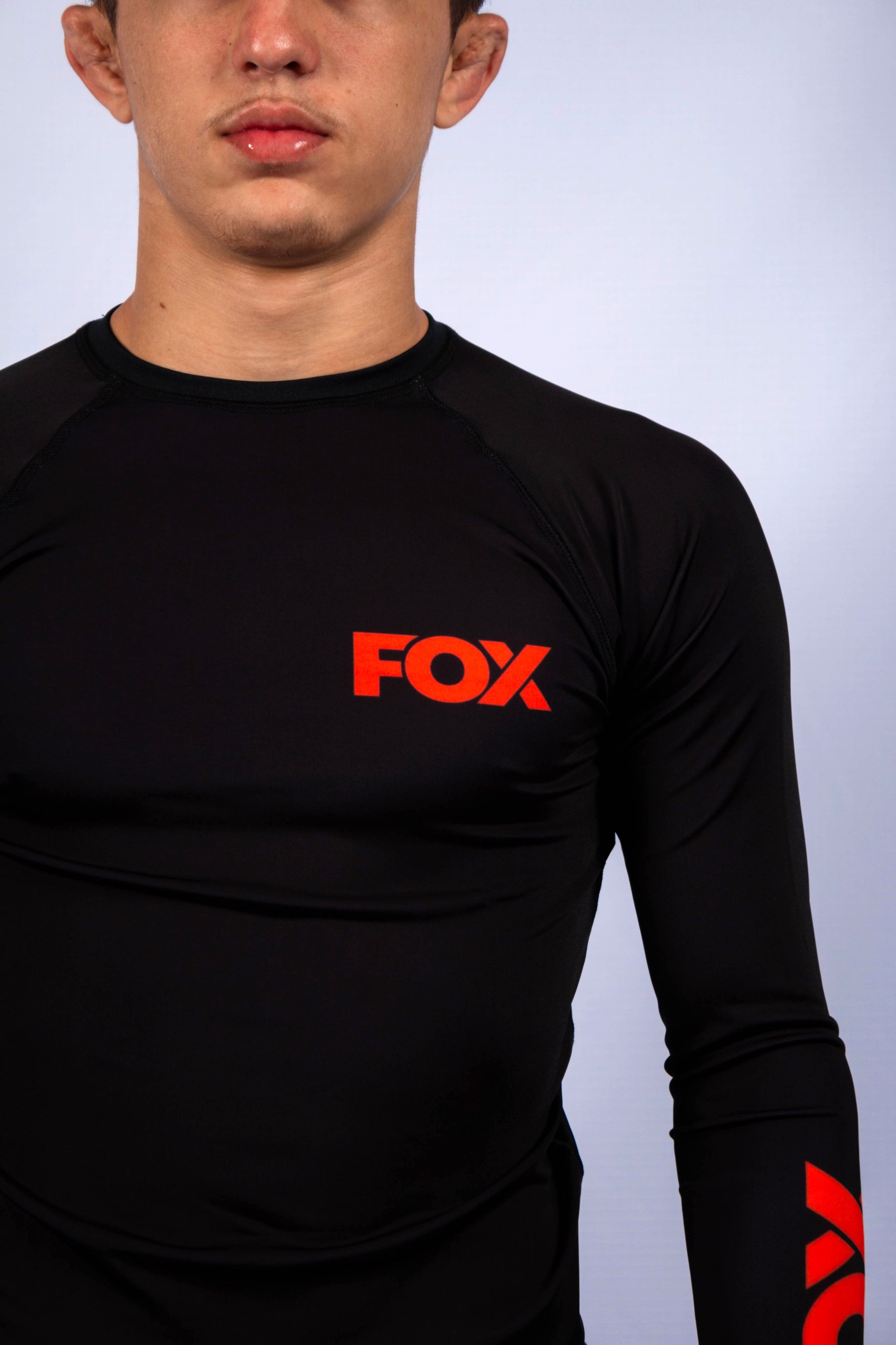 Rash Guard Jiu-Jitsu FOX FW Preta Manga Longa (Logo Laranja) UV 50+